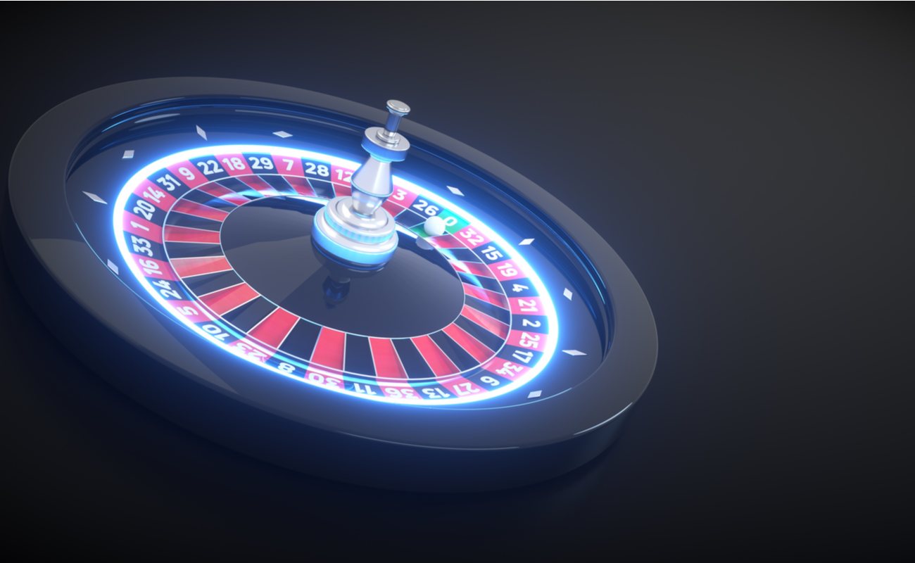 Light up roulette table, with blue lights and black background.