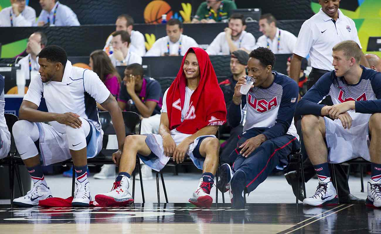 Stephen Curry resting and laughing with teammates