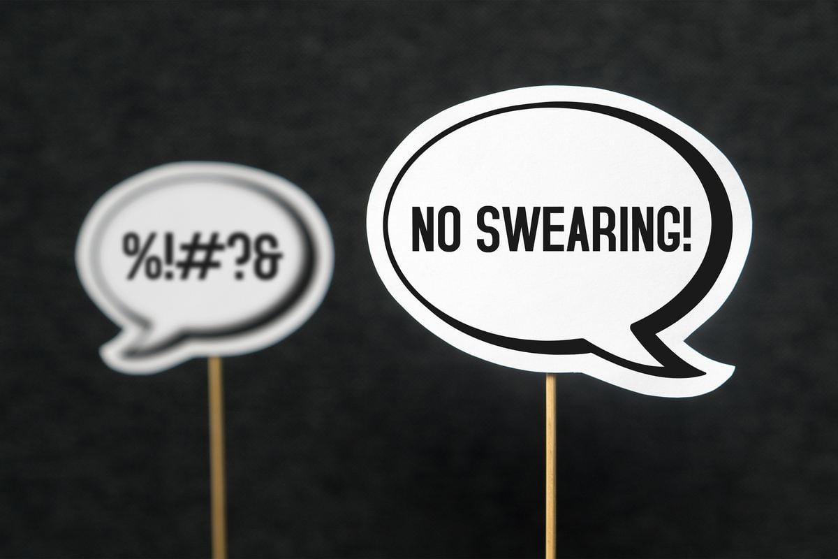 2 black and white speech bubbles indicating swearing and no swearing