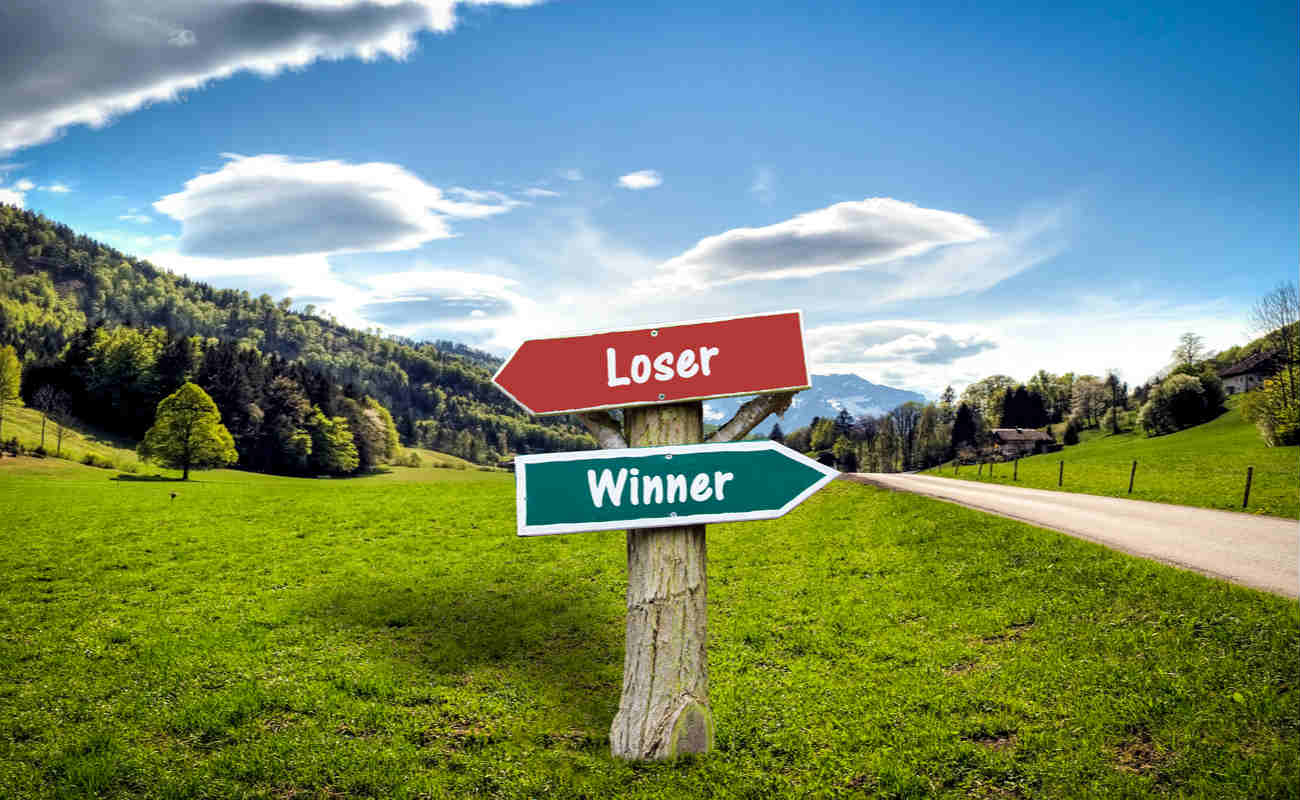 Street Sign with the Direction Way to Winner versus Loser