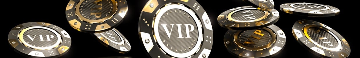 Casino chips with the word “VIP”, seen falling down as if scattered.

