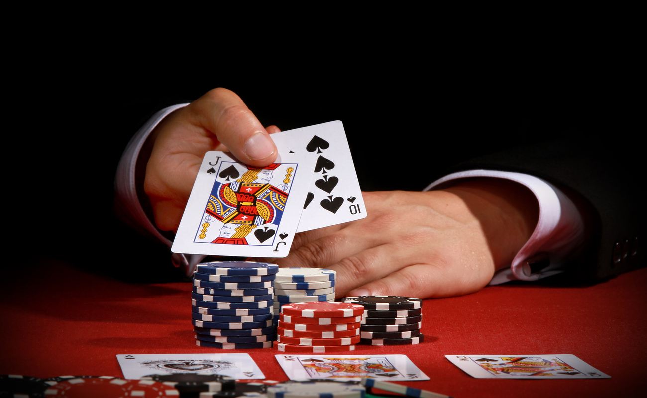A man reveals his poker hand.