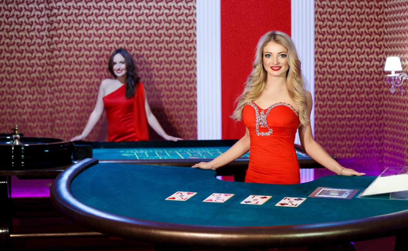 Two live dealer casino game hosts are ready to start their games.