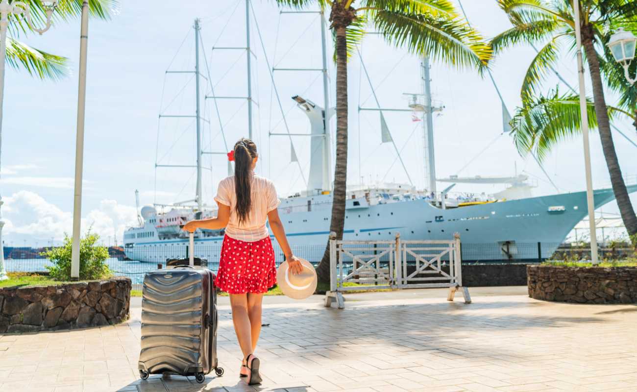 Woman walks towards cruise liner