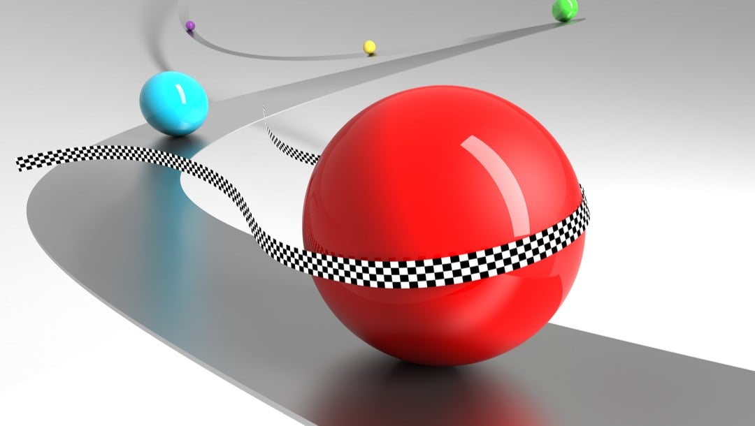 A 3D rendering of red glass marble crossing the finish line in a race.