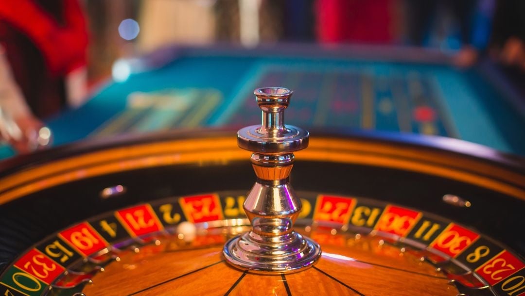 close up of a wooden roulette table in a casino