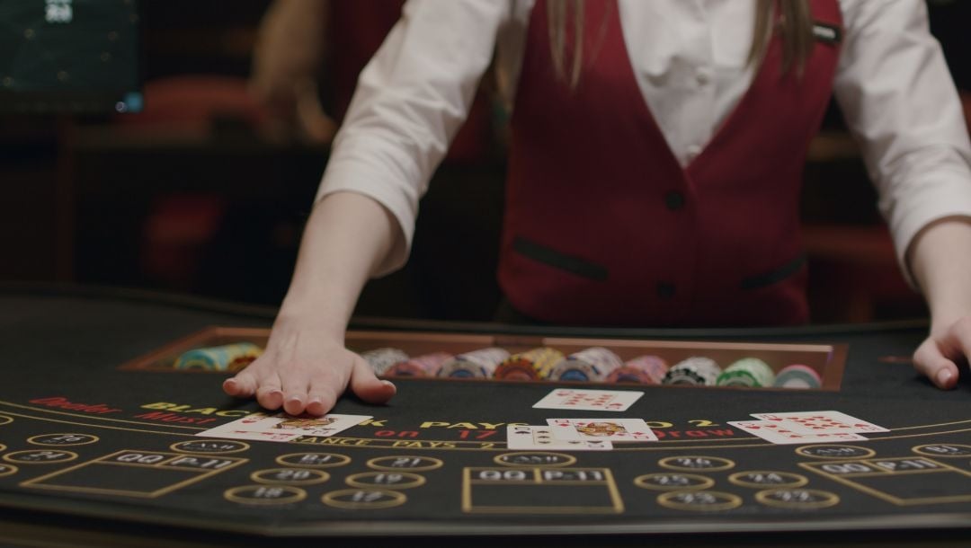 why-do-blackjack-dealers-swipe-the-table-betmgm