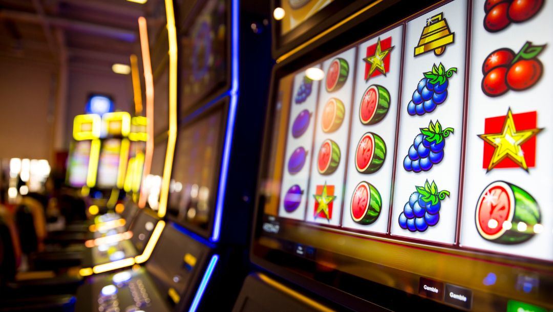 A slot machine screen, with slot machine symbols displayed on the screen.