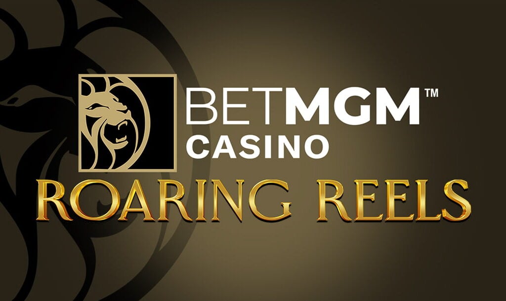 The title screen for BetMGM Casino Roaring Reels. The game logo appears on a simple grey background with the silhouette of the iconic MGM lion on it. The BetMGM Casino logo appears above the words “Roaring Reels” in gold letters.