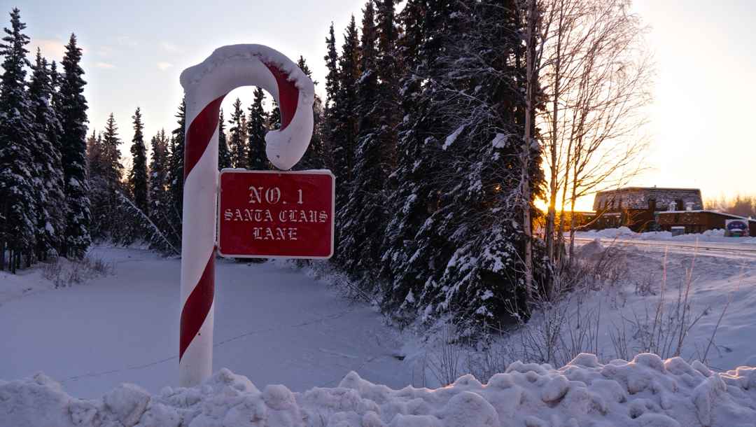 A Candy cane pole with a sign saying “No 1 Santa Claus Lane” in North Pole, Alaska