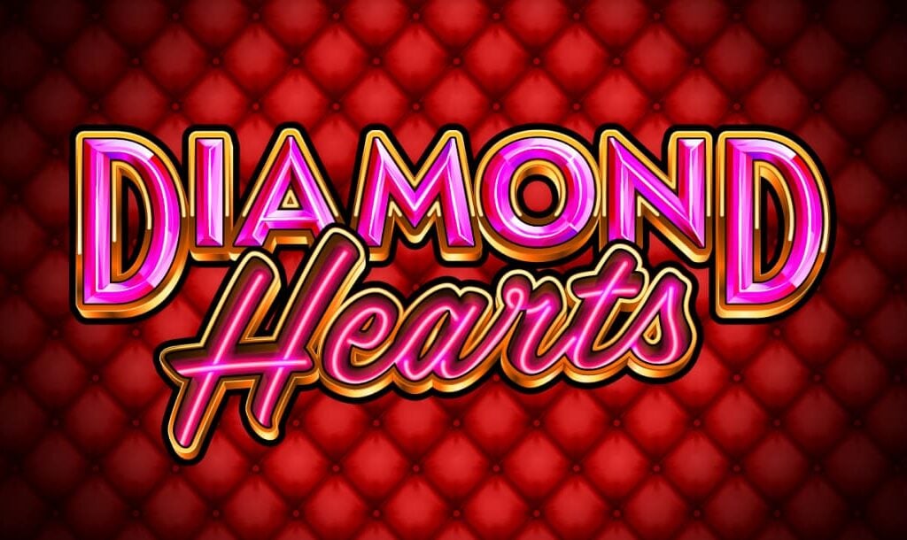 The Diamond Hearts title screen. The background is a red velvet cushion surrounded by an elegant golden frame. In the foreground is the title Diamond Hearts in a pink font set against a diamond heart with a golden frame.