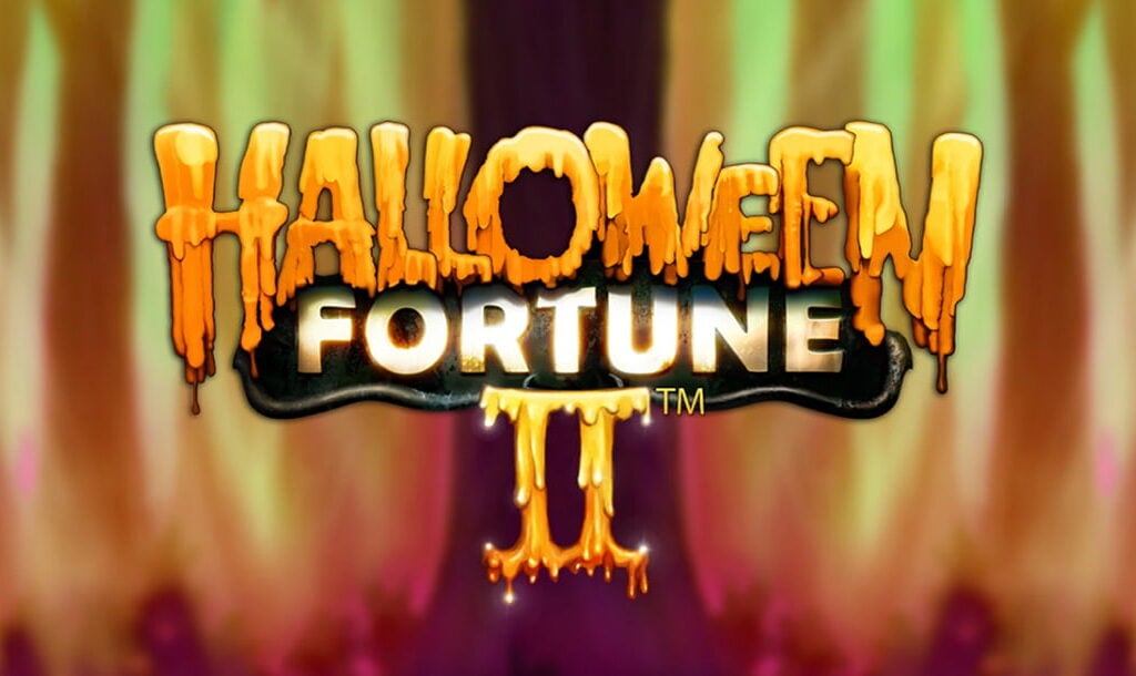 The Halloween Fortune II online slot game loading screen featuring the game logo with blurred flames in the background.