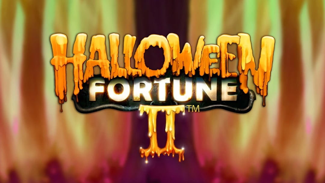 The Halloween Fortune II online slot game loading screen featuring the game logo with blurred flames in the background.