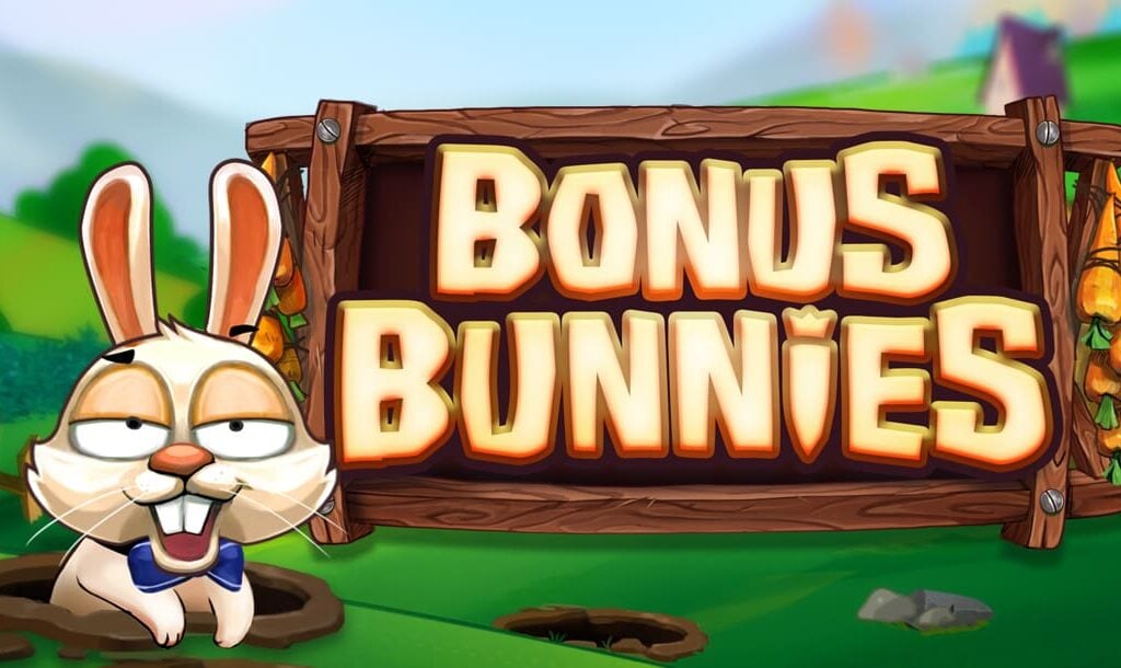 The title screen for the Bonus Bunnies slot game, with a long stretch of grassy hills as the background. The game title appears on a sign made of wood. A cartoon bunny wearing a bow tie is popping out of a hole next to the title.