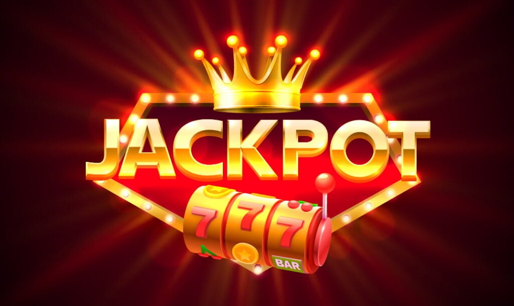 A vector image showing the word “Jackpot” in shining, golden letters on a dark red background. The word “jackpot” is surrounded by a thin gold frame with small lights on it and there is a crown above it and three-reel slot below it.