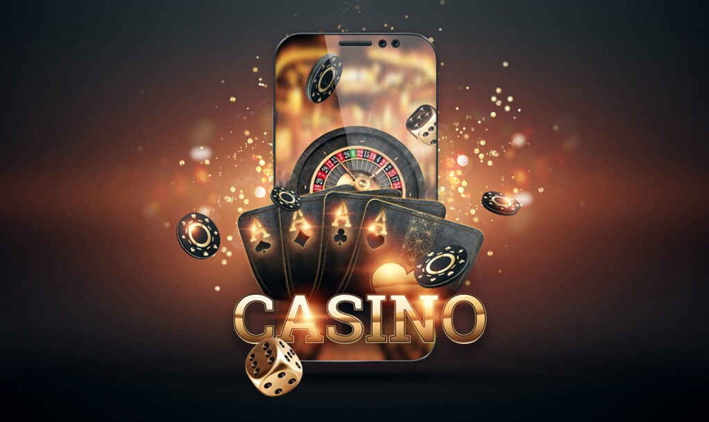 A collection of colorful casino gambling chips arranged around a roulette wheel on a sleek black background.